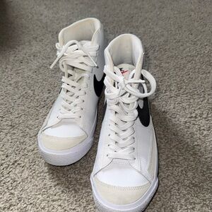 Nike Women's White High-Top Sneakers with Black Swoosh